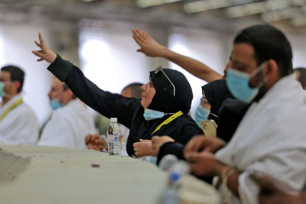 Pilgrims 'stone the devil' with sanitised pebbles in hajj ritual